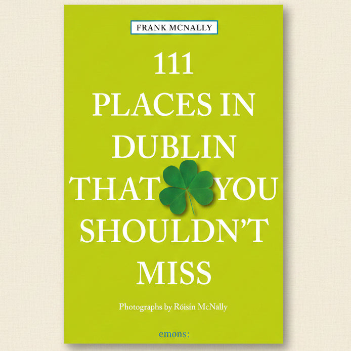 Book cover of '111 Places in Dublin That You Shouldn't Miss' with a green background and shamrock.