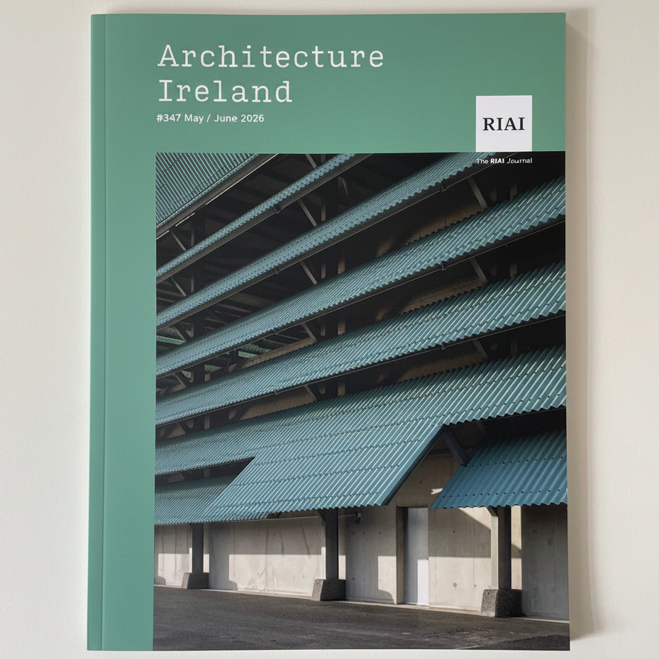 A magazine or book cover titled "Architecture Ireland" with a teal-green header and a large architectural photograph of layered blue-gray awnings over a concrete structure. The RIAI logo appears in the top right, and the cover is photographed against a plain light background.