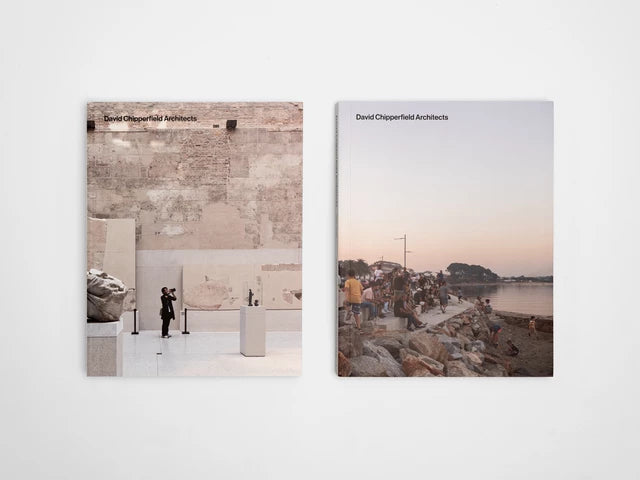 Two square art prints or book-cover-like panels displayed side by side against a light gray wall. The left panel shows an interior architectural scene with a person standing in a gallery; the right panel shows an outdoor waterfront scene at dusk with a crowd along a promenade.