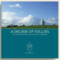 Book cover of 'A Decade of Follies' with a scenic landscape and tower.