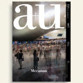 Magazine cover with 'au' logo and blurred crowd in a modern building