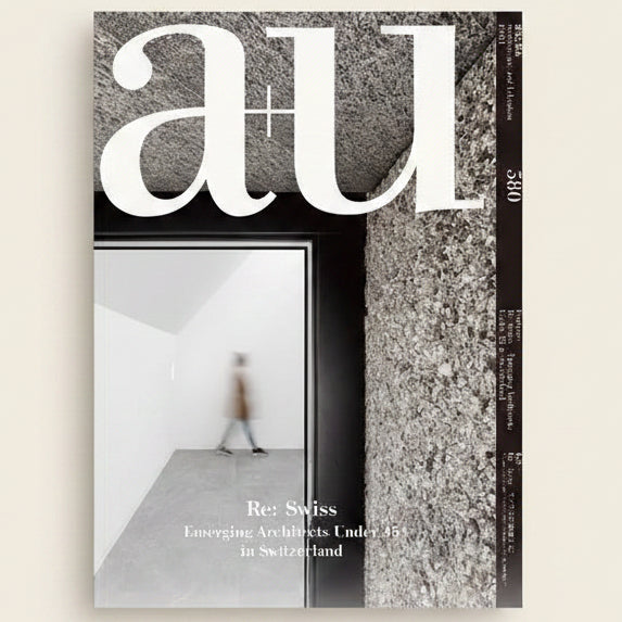 Cover of a magazine with architectural theme featuring text 'a+u' and a blurred image of a person walking.