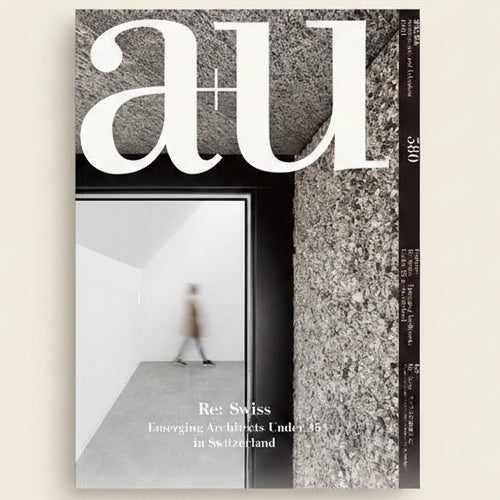 Cover of a magazine with architectural theme featuring text 'a+u' and a blurred image of a person walking.