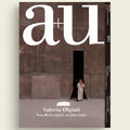 Cover of a magazine featuring a person standing in a doorway with 'au' branding.