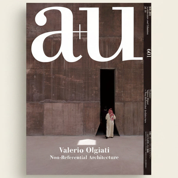 Cover of a magazine featuring a person standing in a doorway with 'au' branding.