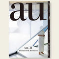 Magazine cover with a person in a white outfit standing in front of a glass wall.