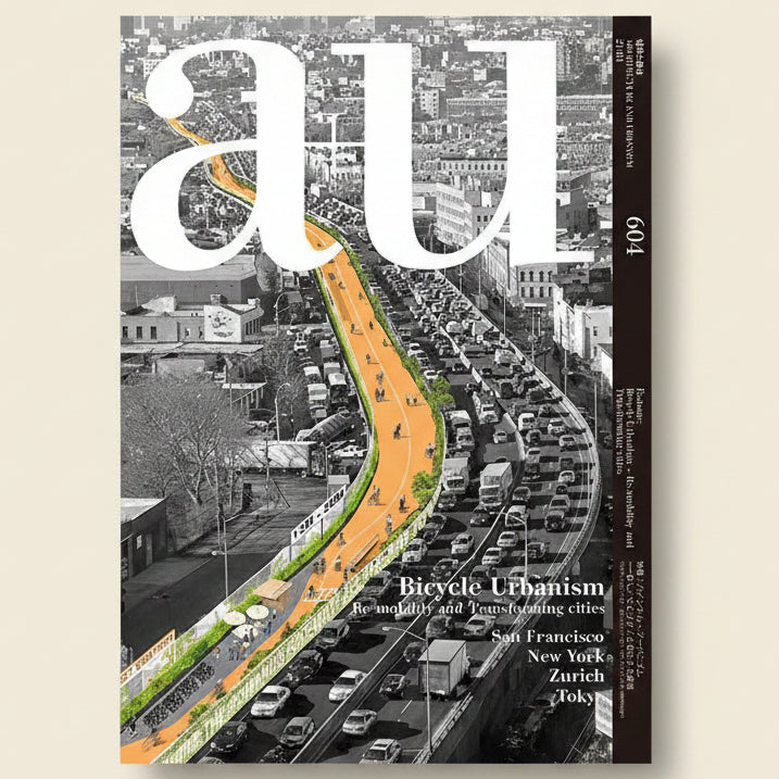 Cover of a magazine titled 'AU' featuring an illustration of a bicycle path on a city street.