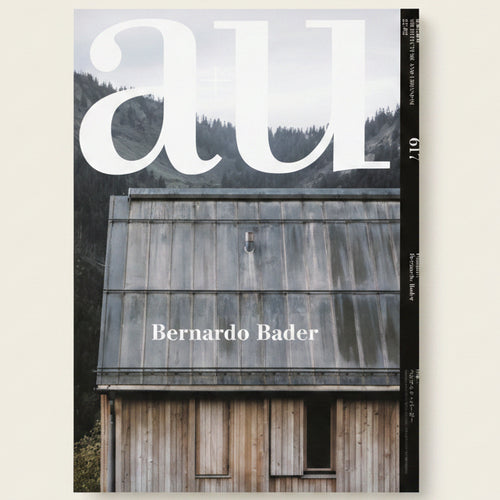 Magazine cover with a wooden building and 'all' branding