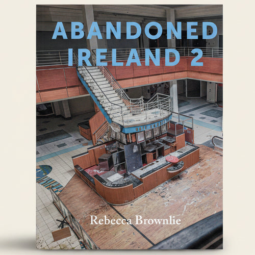 Book cover of 'Abandoned Ireland 2' by Rebecca Brownlie featuring an abandoned building interior.