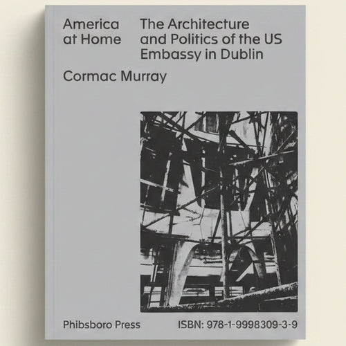 Book cover of 'America at Home: The Architecture and Politics of the US Embassy in Dublin' by Cormac Murray with a black and white photo of an embassy structure.