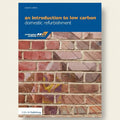 Book cover of 'An Introduction to Low Carbon Domestic Refurbishment' with a brick wall background.