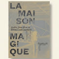 Book cover of 'La Maison Magique' with architectural design and text.