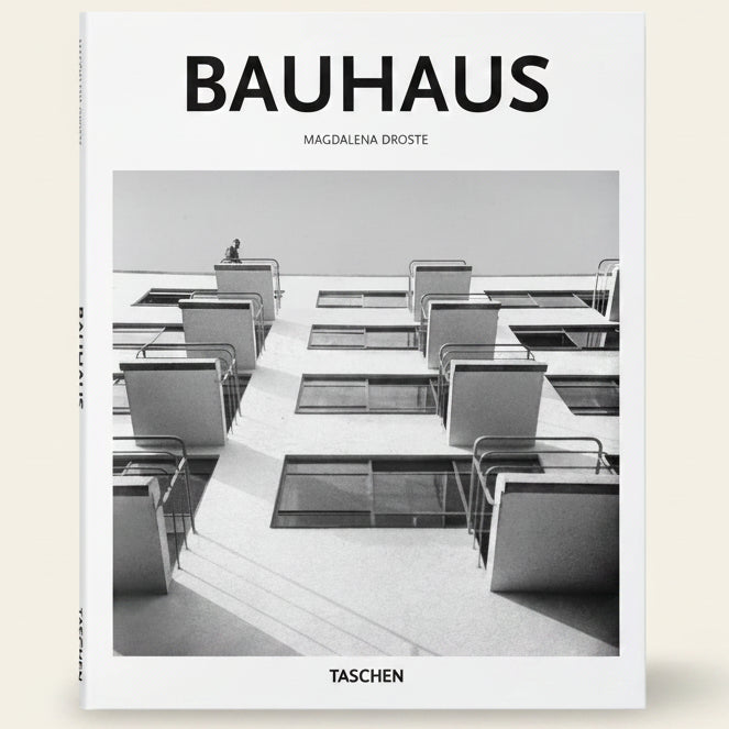 Book cover of 'Bauhaus' by Magdalena Droste with a black and white photo of a Bauhaus architectural design.