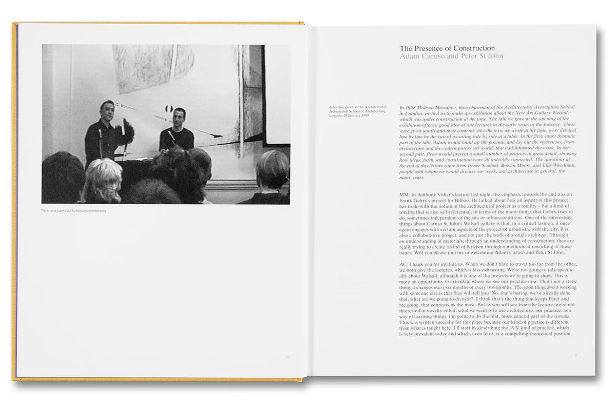 An open book showing a printed page with a black-and-white photograph on the left and columns of text on the right. The book has a thin gold or yellow border visible along the left edge, photographed against a plain white background.