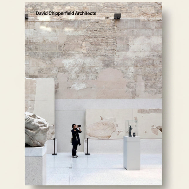 Person taking a photo in a modern art gallery with 'David Chipperfield Architects' branding.