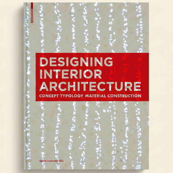 Book cover of 'Designing Interior Architecture' with a red banner on a textured beige background