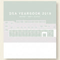 Promotional graphic for DSA Yearbook 2019 with a building illustration on a light gray background.