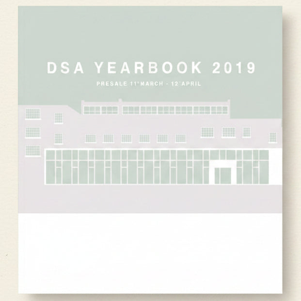 Promotional graphic for DSA Yearbook 2019 with a building illustration on a light gray background.