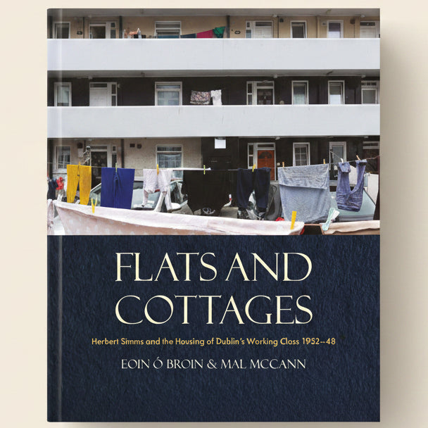 Book cover of 'Flats and Cottages' with laundry hanging on a line in front of a building.