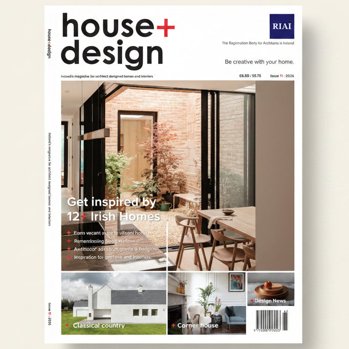 Cover of 'house+design' magazine featuring a modern interior design with large windows and a dining table.