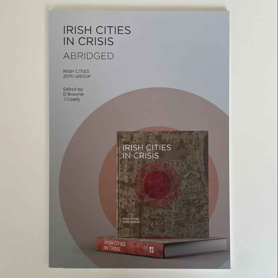 The front cover of the book 'Irish Cities in Crisis: Abridged' is shown against a plain light background. The cover is light gray with black text and a large muted pink circular graphic behind a smaller inset image of the book with a red circular emblem.