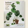 Book cover of 'Indoor Green: Living with Plants' featuring a potted plant on a white background.