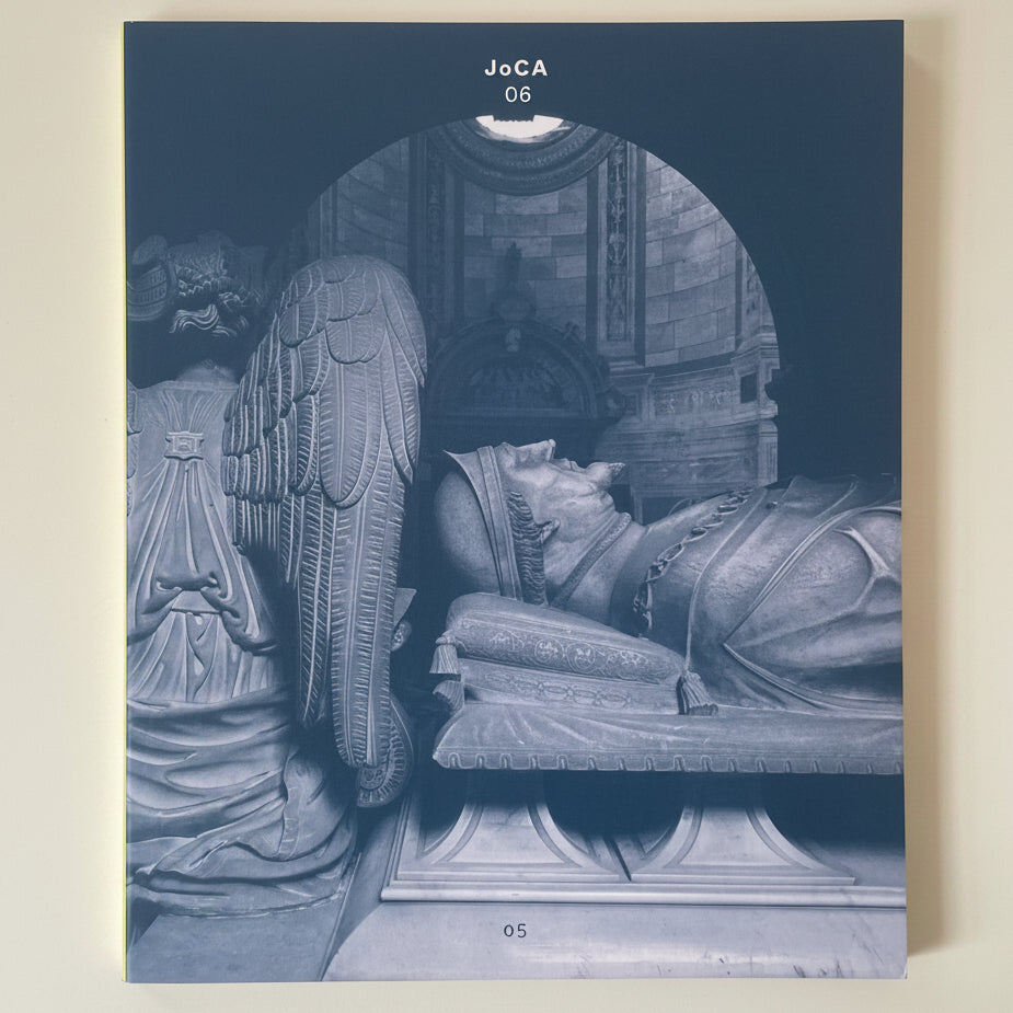 Book cover with stone sculpture of a figure with wings and a sarcophagus, featuring 'JoCA' branding.