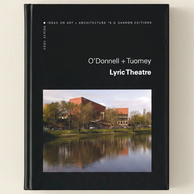 Book cover of 'Lyric Theatre' by O'Donnell + Tuomey with a photograph of a building by a lake.