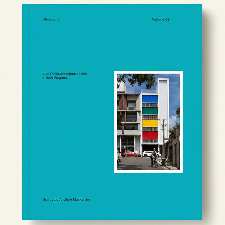 Book cover of 'Minimono Volume 02' with a colorful building and blue background
