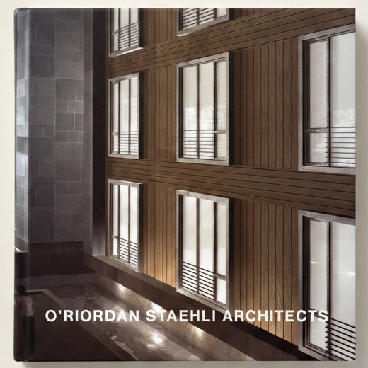 Modern architectural design with wooden panels and glass windows, featuring 'O'Riordan Staehli Architects' branding.