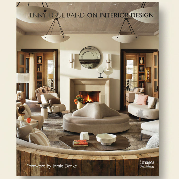 Interior design book cover with a modern living room featuring a fireplace and furniture.