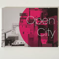 Book titled 'Open City' with a pink and black cover design on a white background