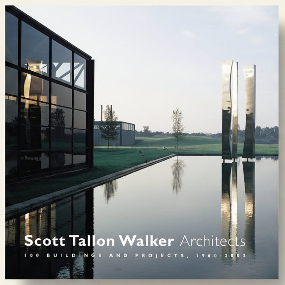 Modern architectural building with water reflection and 'Scott Tallon Walker Architects' text.