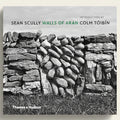 Book cover of 'Walls of Aran' with stone wall design and publisher's name.