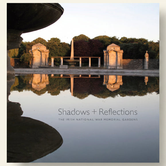 Memorial garden with statues reflected in water, titled 'Shadows + Reflections'.