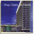 Modern architectural building with 'Shay Cleary Architects' branding against a blue sky.