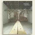 Album cover with a split image of a room and a hallway, titled 'Shifting Ground'.