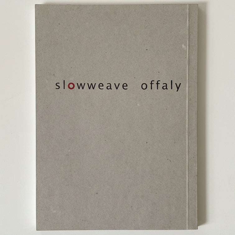 Gray book with 'slowweave offaly' text on a white background