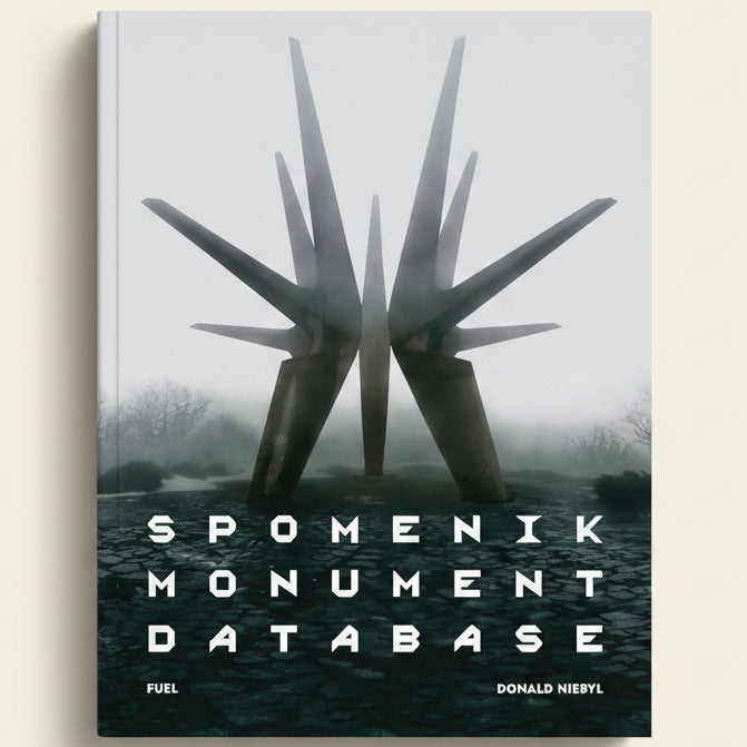 Spomenik Monument Database cover with sculpture in foggy landscape