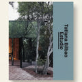 Cover of a book or magazine featuring an architectural design with trees and a building.