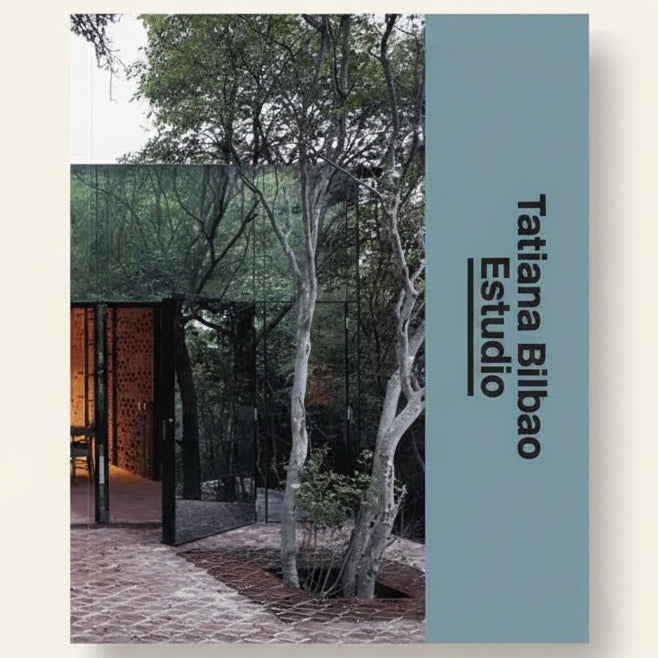 Cover of a book or magazine featuring an architectural design with trees and a building.