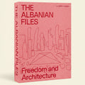 The front and spine of the book 'The Albanian Files: Freedom and Architecture' by Lars Müller Publishers, featuring a salmon pink textured cover with red typography and minimalist architectural line drawings.