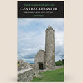 Book cover of 'Central Leinster: Kildare, Laois and Offaly' by Andrew Tierney with a stone tower and wall on a cloudy day.