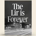Black and white street scene with text 'The Lir is Forever' over a building.