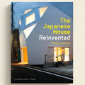 Book cover of 'The Japanese House Reinvented' with a modern house and bicycle.