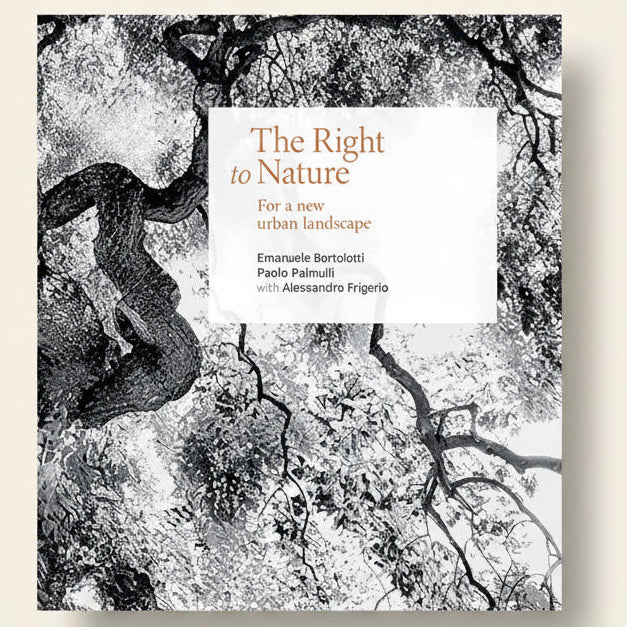 Book cover with tree branches and a white square displaying text on a black background