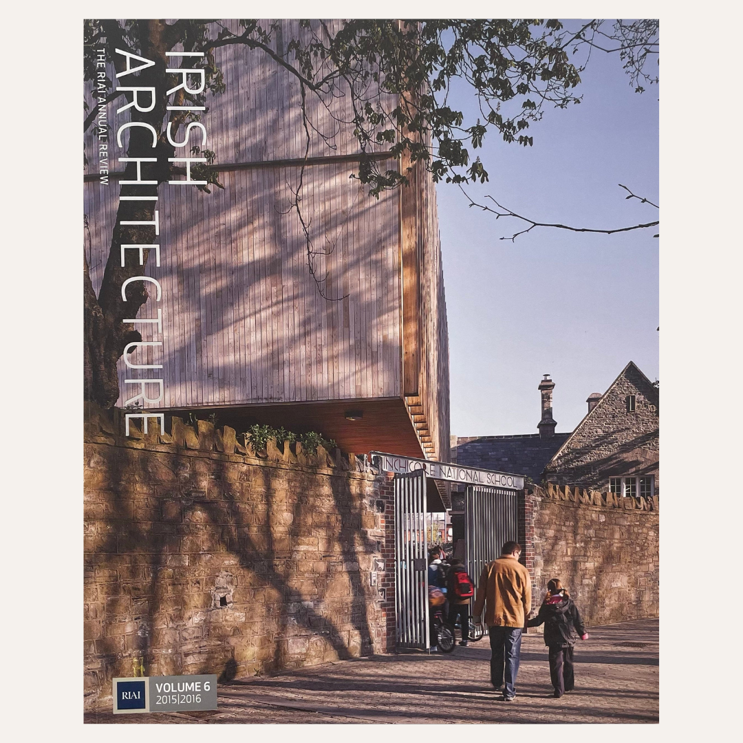 Front cover of the book 'Irish Architecture: The Built Environment Volume 6: Dundee 2015' by RSM, showing a photograph of a modern wooden building over a stone wall with people walking outside.