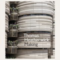 Book cover for 'Making' by Thomas Heatherick, featuring a close-up photograph of a modern cylindrical building facade with horizontal wood-toned panels and small balconies with plants.
