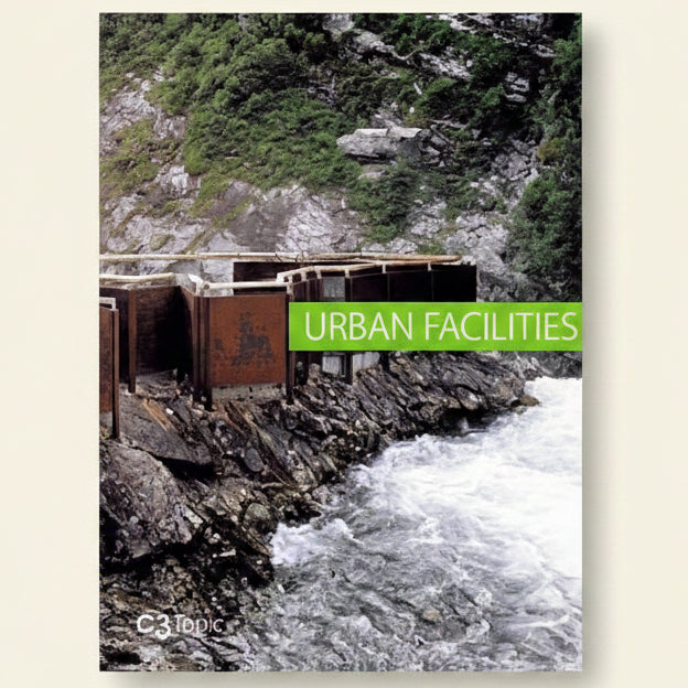 Urban facilities sign on a rocky cliff with water below