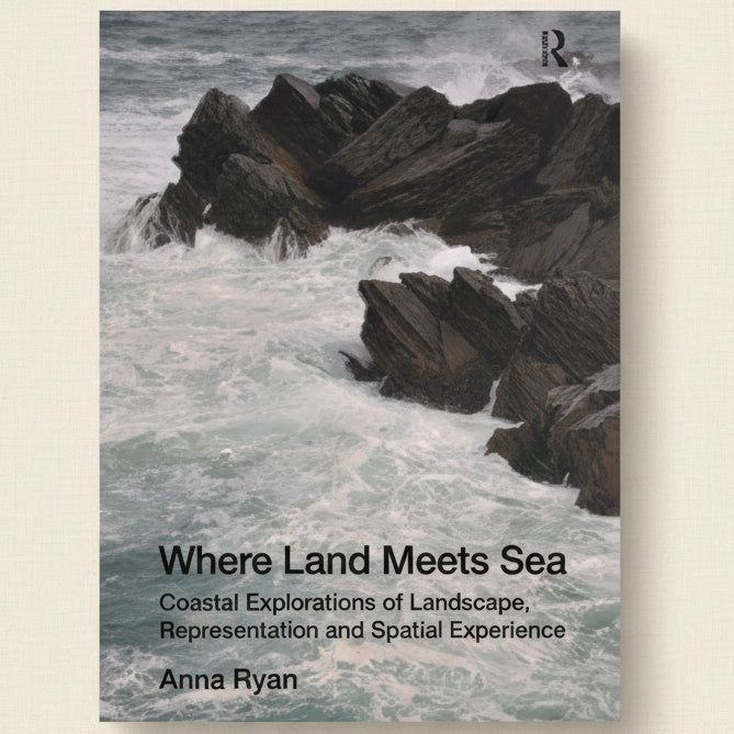 Book cover of 'Where Land Meets Sea' with rocky coastline and waves.